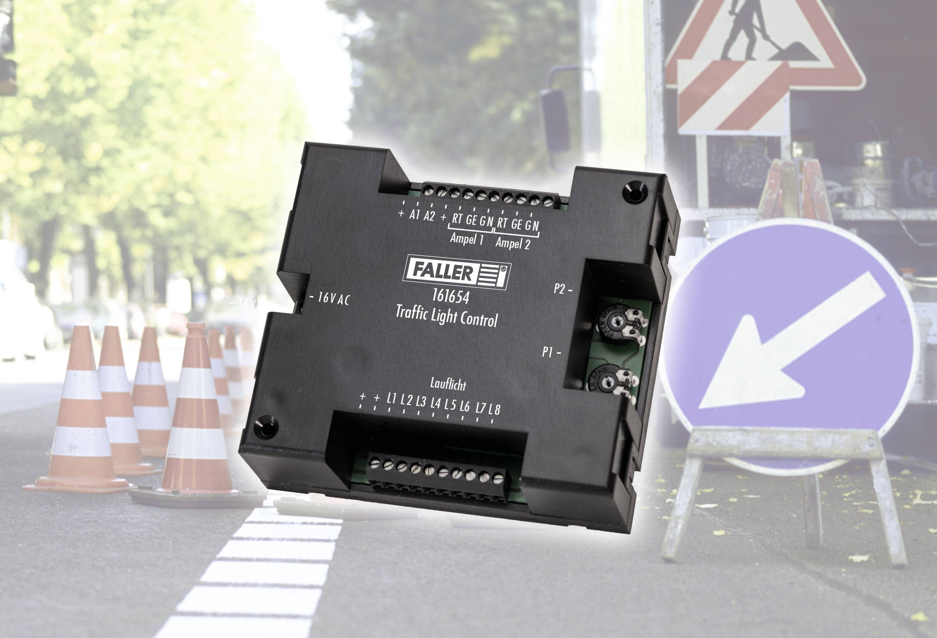 Electronic module for traffic light control in front of a construction site with a diversion sign and traffic guidance cones in the background.