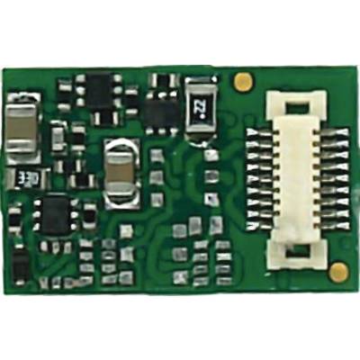 A small green circuit board with various surface-mounted (SMD) components, including resistors and capacitors, on its surface.