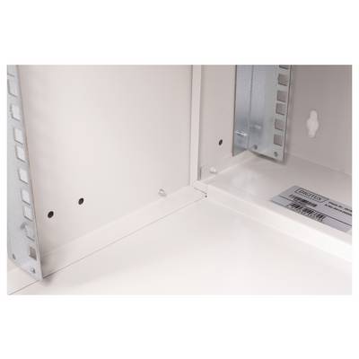 Detailed interior view of a white metal cabinet with metal struts and a label.