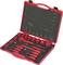 'Red toolbox with various drill head attachments and socket wrench inserts in foam lining, opened on table.'