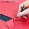 A hand cuts red paper with a craft knife, on which 'ART TISSUE PAPER' is written.