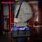 A man is holding a blue tool bag from Workpro, standing in front of industrial-looking pipes in a work area.