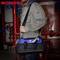 A person in work attire is holding a blue and black tool bag with the 'WORKPRO' logo. Pipes are visible in the background.