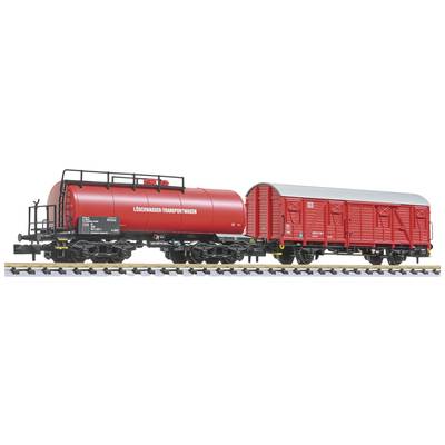 Two red model railway wagons on tracks, a tanker and a goods wagon. Both are depicted in detail.
