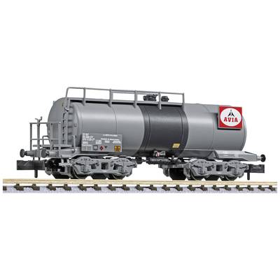 A grey tanker wagon with an 'AVIA' logo travels along a railway track. The wagon is intricately detailed and designed as model railway accessories.