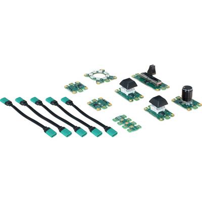Various green electronic circuit board modules and cables, arranged on a surface. Includes rotary and toggle switch modules.