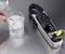 A hand is measuring the water temperature in a beaker using a digital thermometer, which displays 3.8°C.
