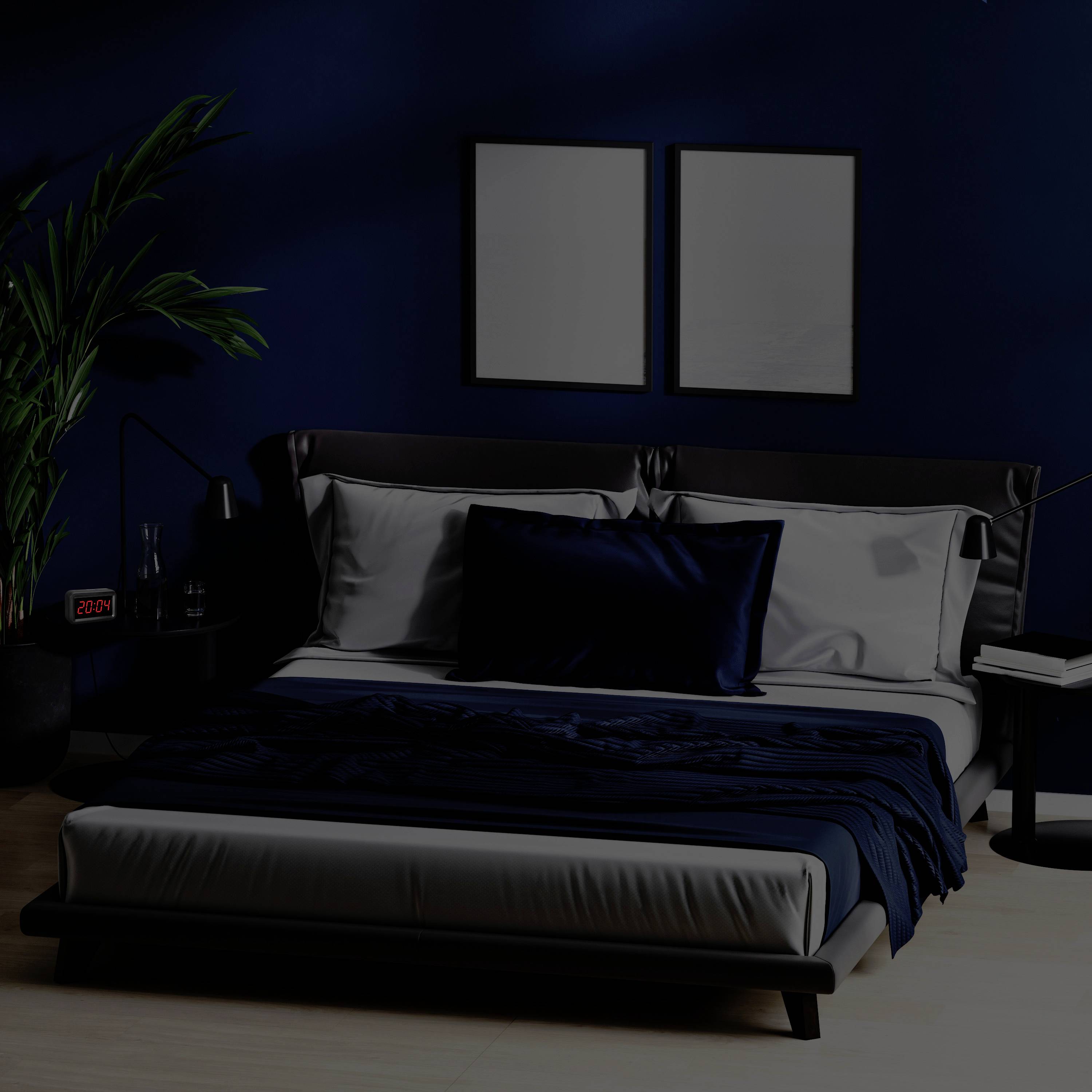 An elegant bedroom with a large bed, dark blue bedding, two wall paintings and a plant in the background.