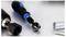 Close-up of a screwdriver with interchangeable bit and socket attachments, alongside a screw and metal tube on a white surface.