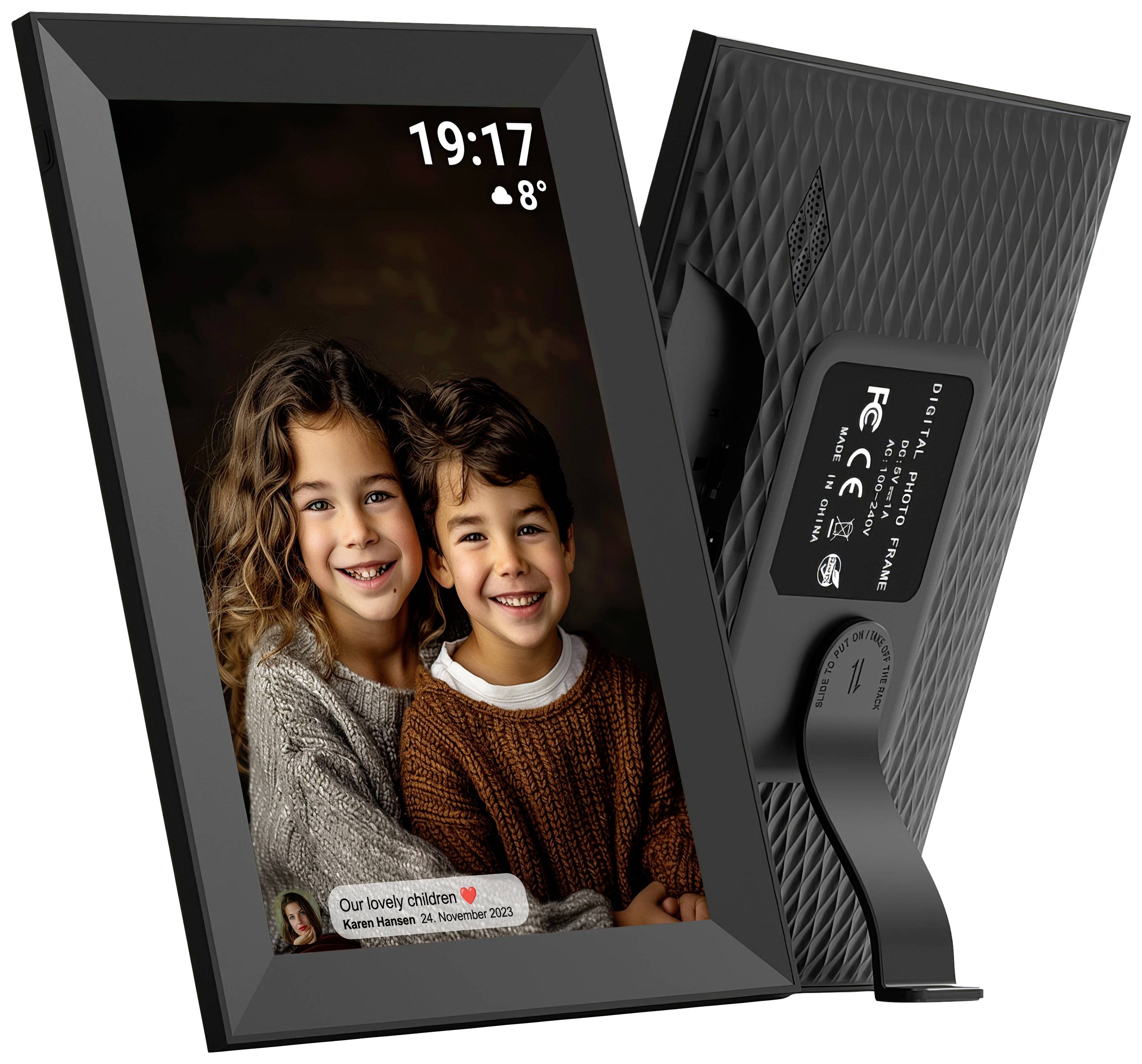 A digital photo frame displays two smiling children in a cosy room. The screen shows the time as 19:17 and 8°C.