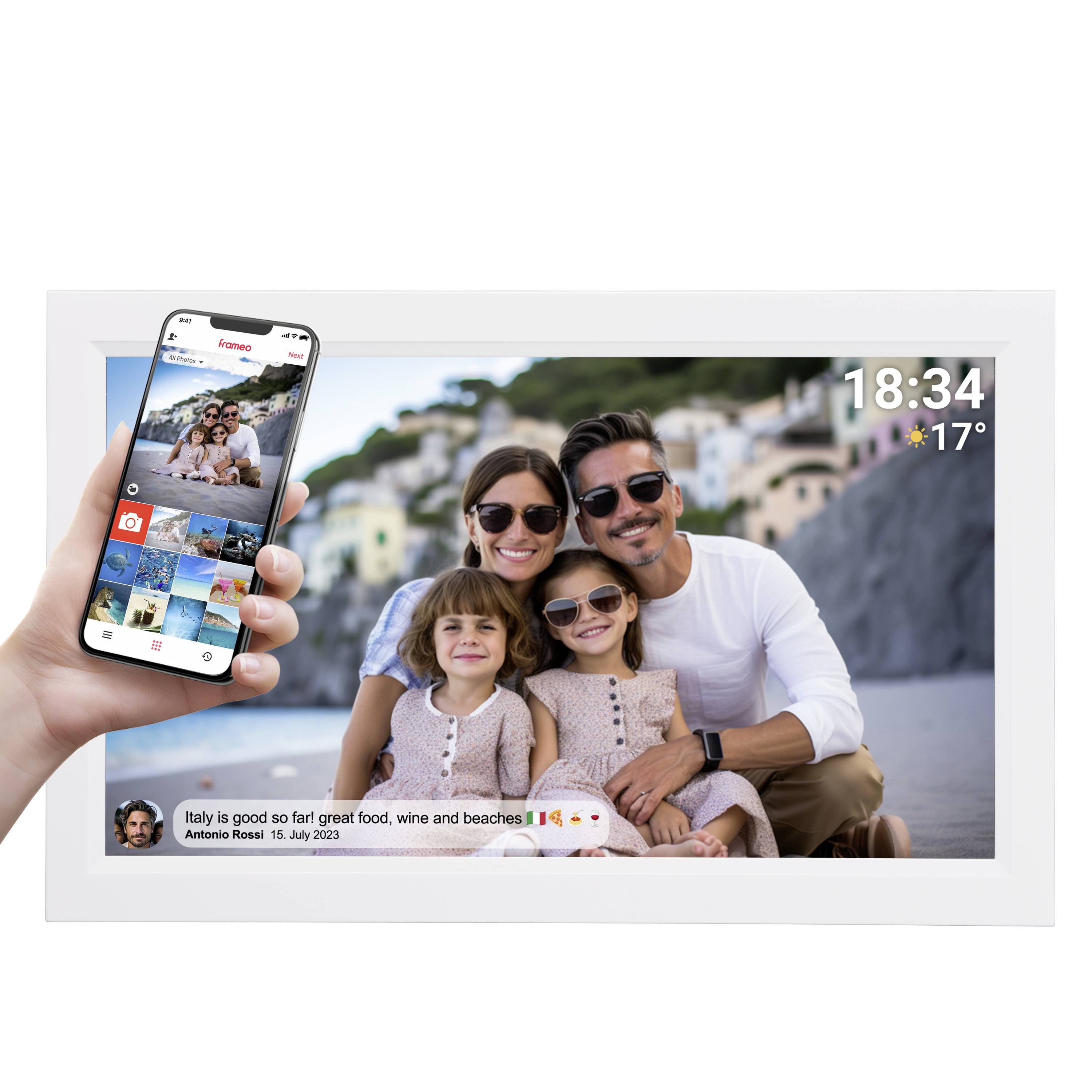 Family photo on the beach, both parents smiling and sitting with their two children. A mobile phone displays the same image. Time and weather shown.