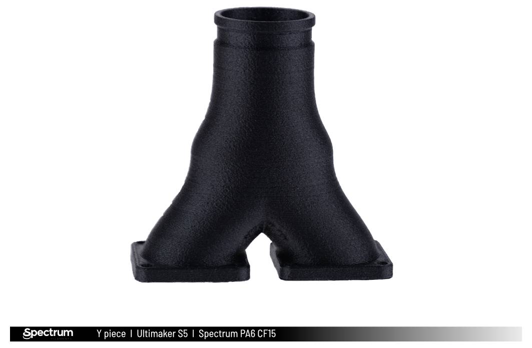 'Black Y-shaped pipe section from 3D printing, with fluttering edges.'
