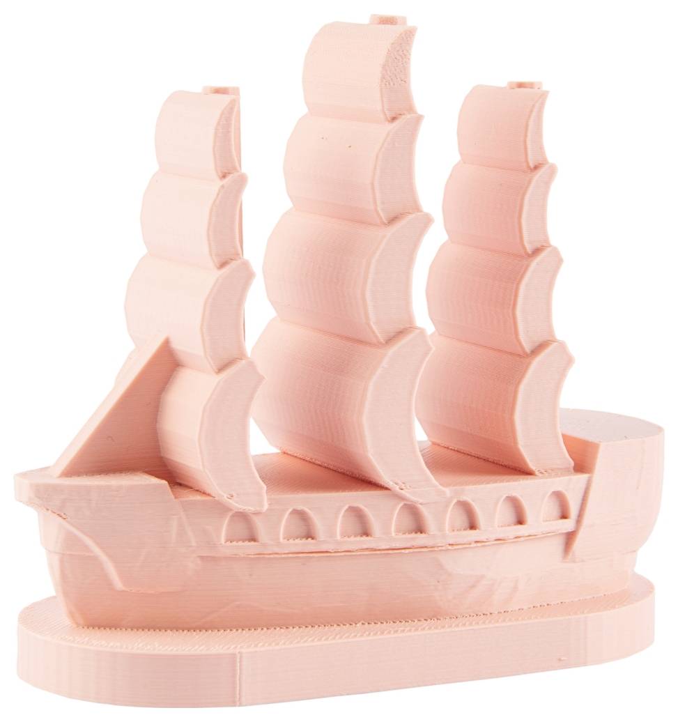 A small, pink 3D-printed model of a sailing ship with multiple sails.