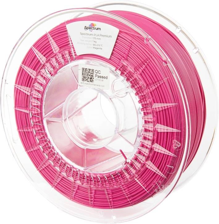 A spool of pink 3D printing filament made of PLA, with brand name visible. Transparent, cylindrical plastic housing with winding mechanism.