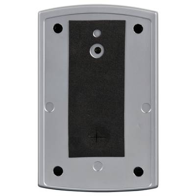 A rectangular, grey device with six round recesses at the corners and centres, cable connection at the top and cross symbol at the bottom.