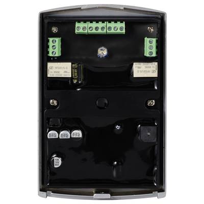 An open electronic device with multiple green terminals and black components mounted on a black circuit board, closely arranged.
