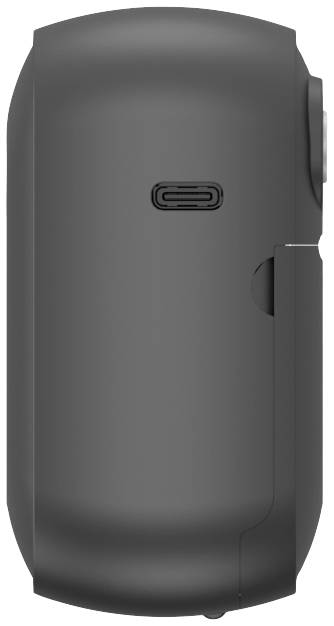 On the side of a black electronic device is an oval power button and a USB-C port in the centre.