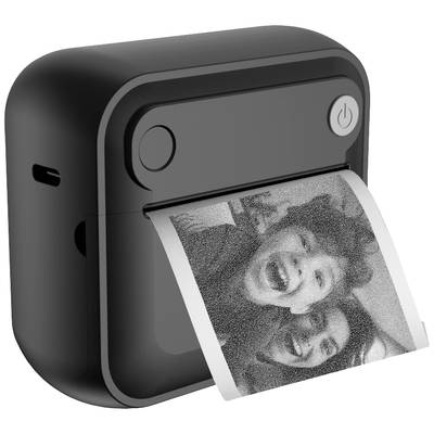 A small, black printer is printing a black and white photograph of two people laughing. The printer has a power button located in the top right-hand corner.