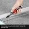 A hand holds a carpet knife with a black blade, cutting along a ruler. Text: 'Extremely sharp, long-lasting blades'.