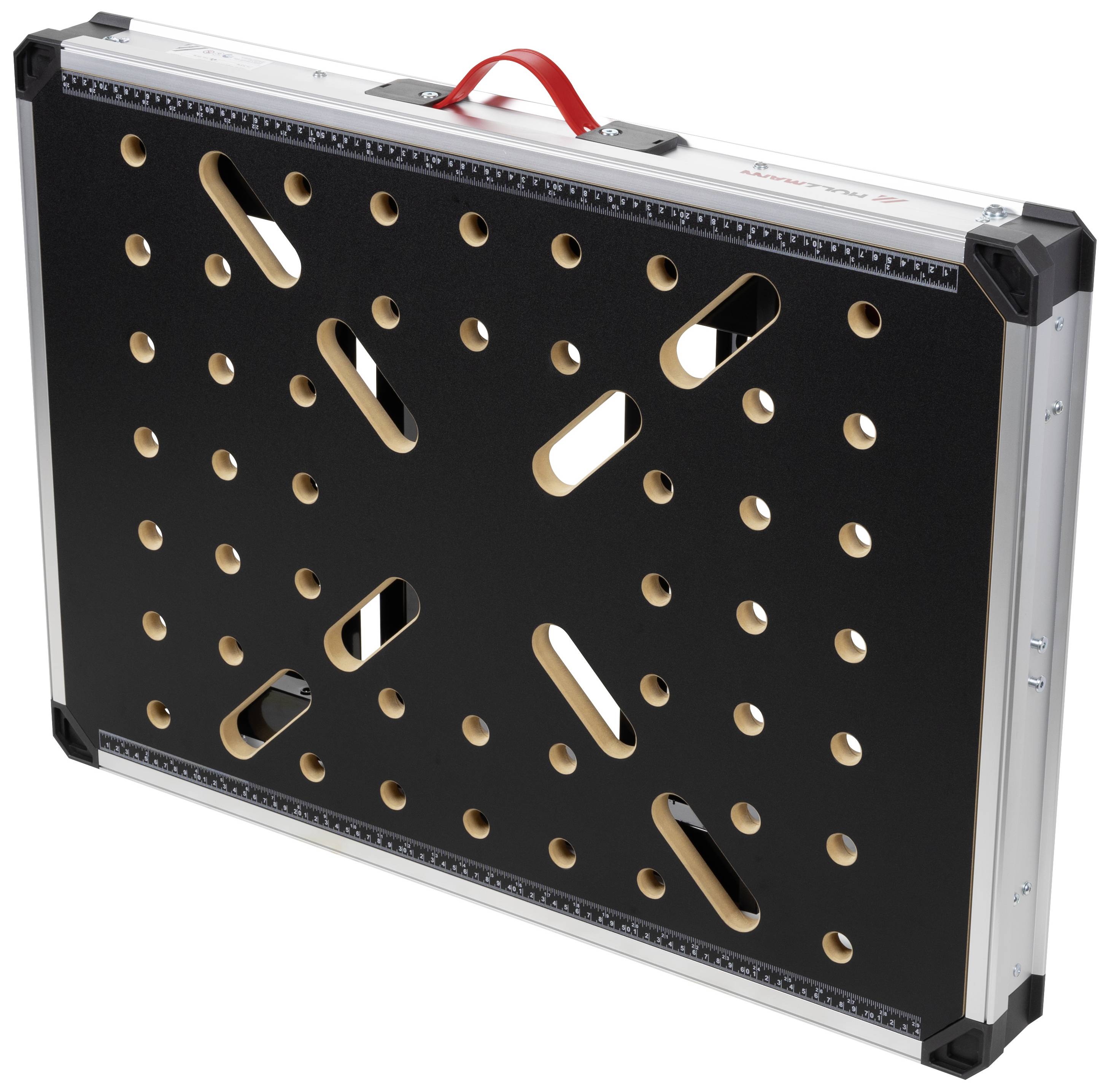 Tool case in a rectangular shape with black sides and a red handle. Multiple holes of varying sizes on the top surface.