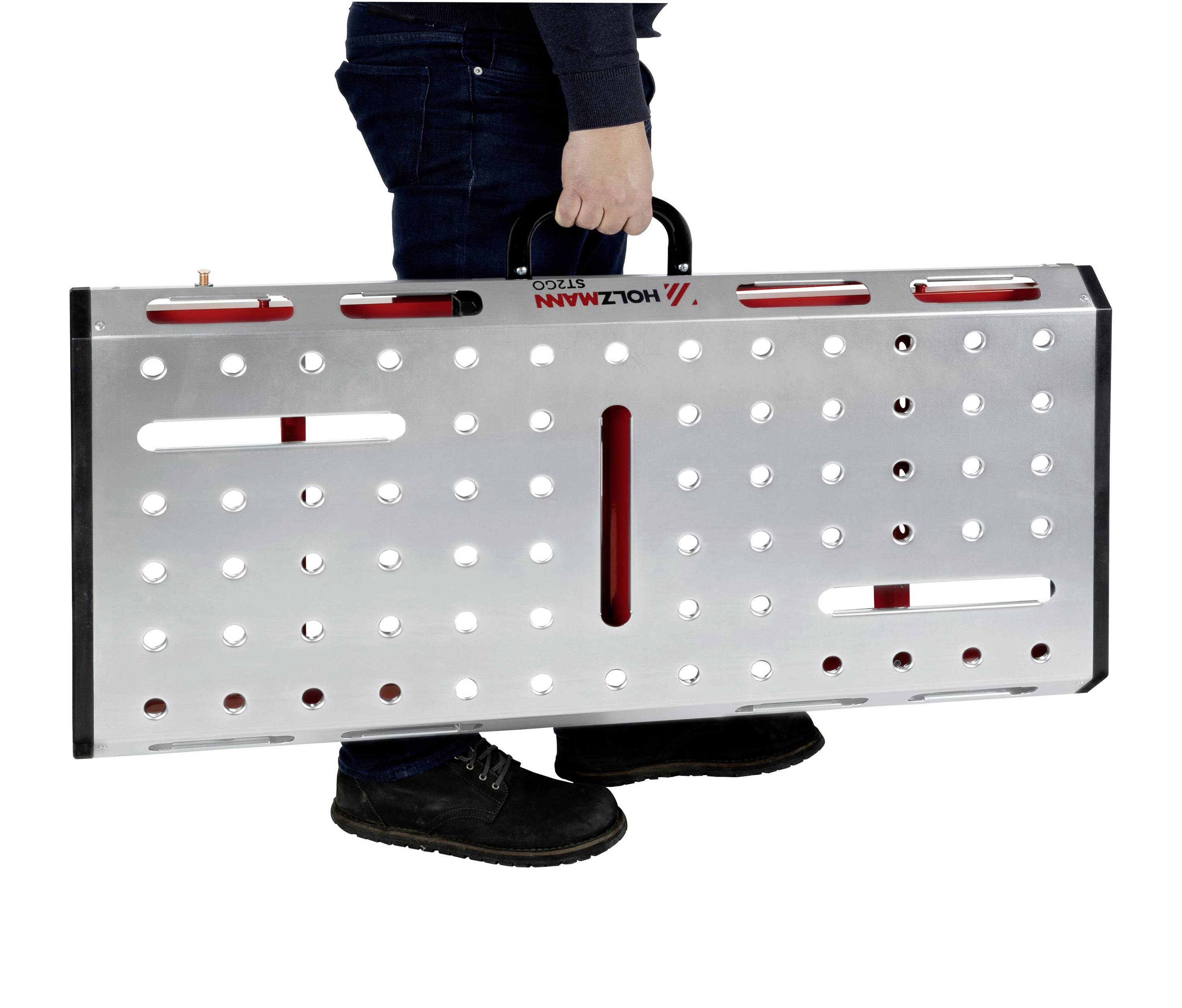 'A person is carrying an aluminium box with holes and a handle, presumably portable and suitable for tools or equipment.'
