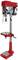 'Pillar drilling machine, red and silver, vertically aligned. With hand crank, adjustable drilling table, protective cover present.'