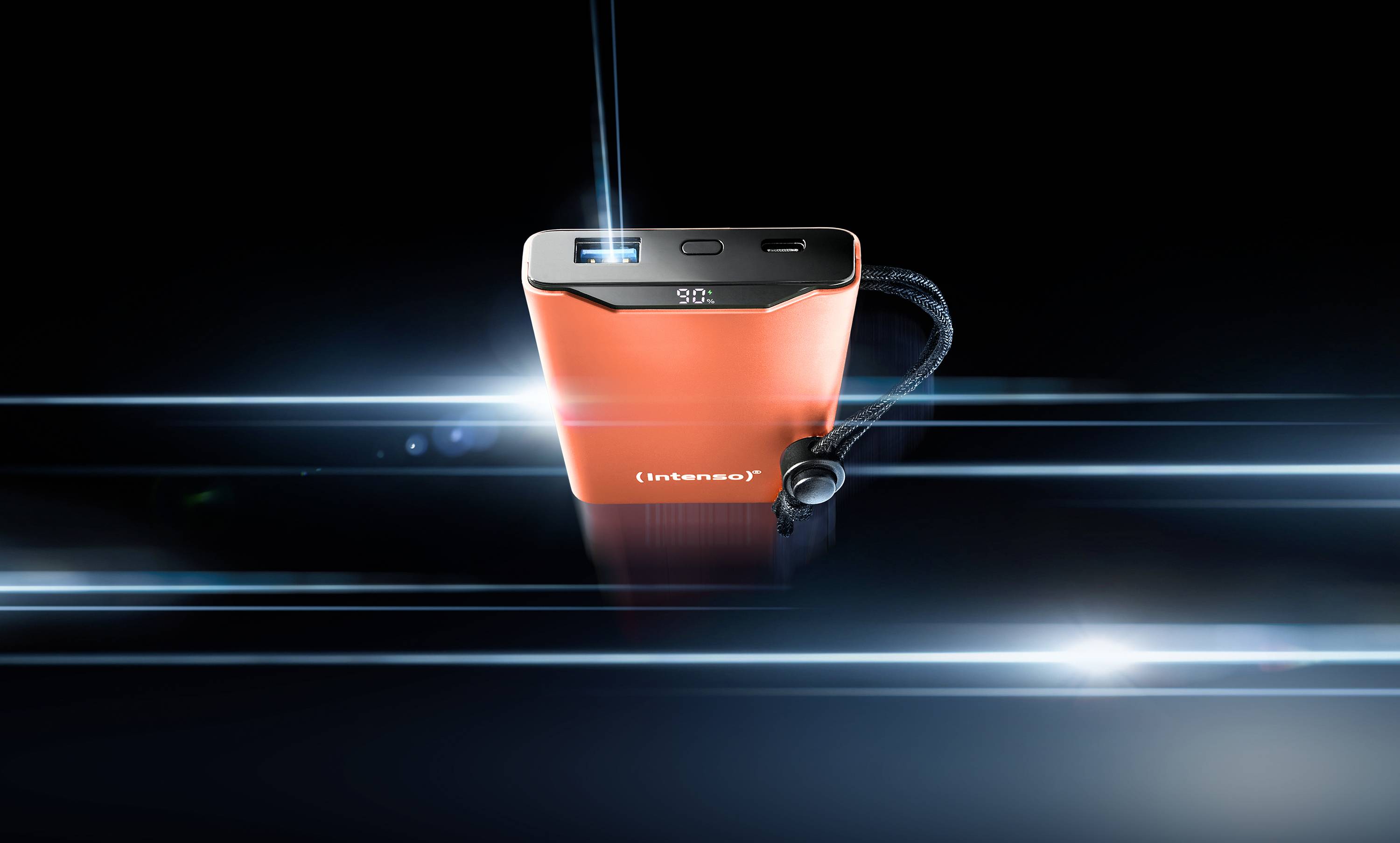 A red power bank with an LED display and USB ports, highlighted by blue light effects on a black background.