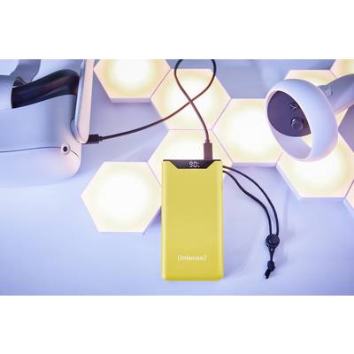 Yellow Intenso charger with cable next to VR headset in front of illuminated hexagons on a blue background.