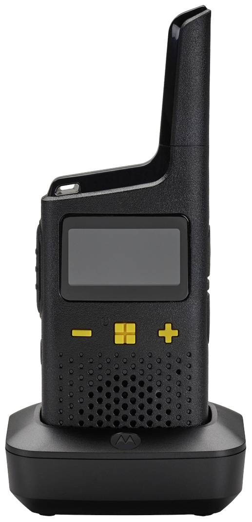 A black walkie-talkie with yellow buttons sits on a charging station. The device has a large display and a long antenna.