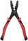 Black crimping pliers with red handles for stripping cables. Shows various size markings on the plier tips.