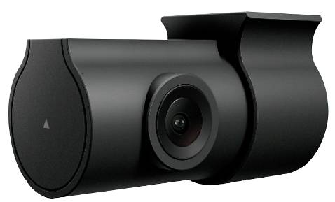 Black surveillance camera with cylindrical design and central lens mounted in a dimly lit room.