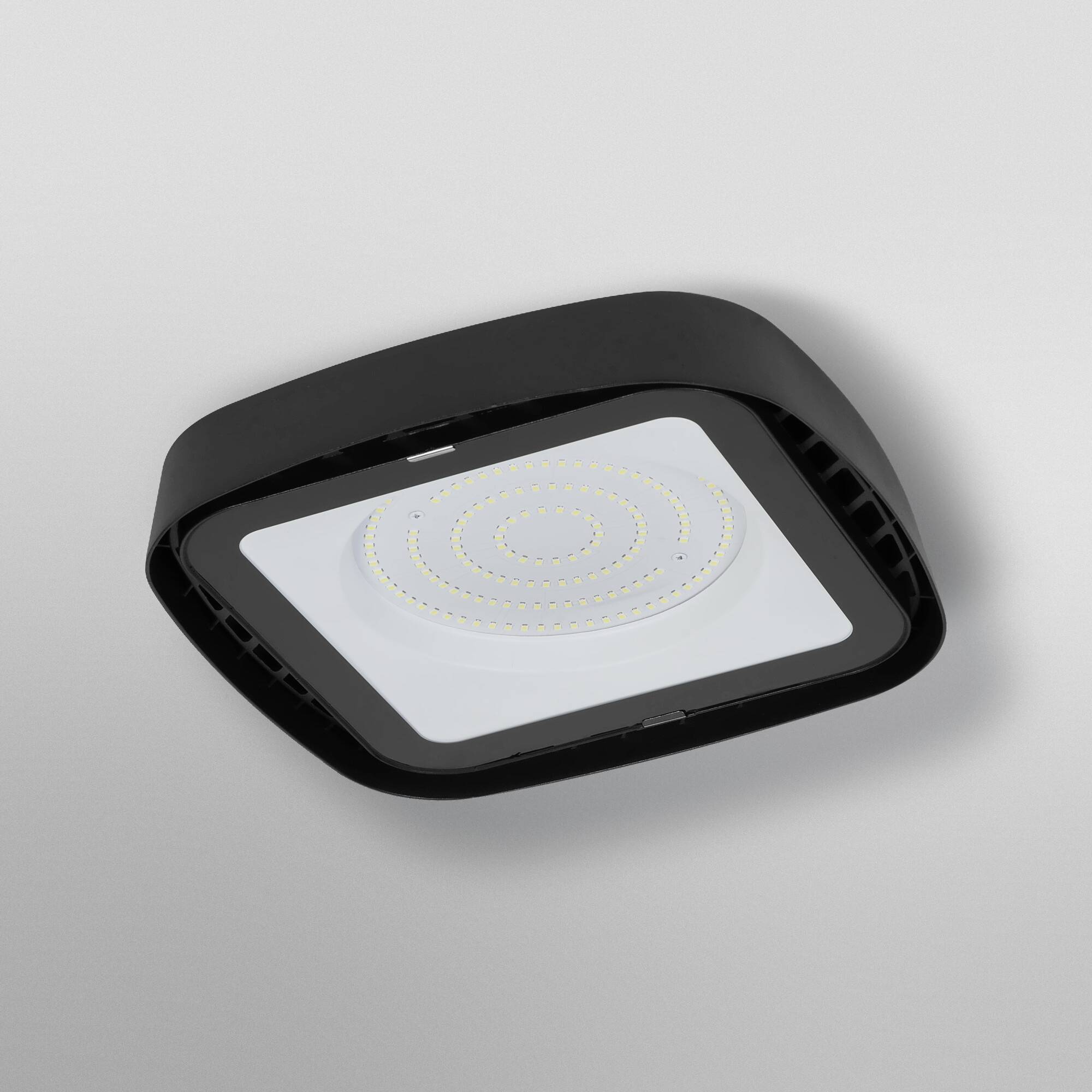 A rectangular black LED ceiling light with spiral-arranged light points against a grey background.