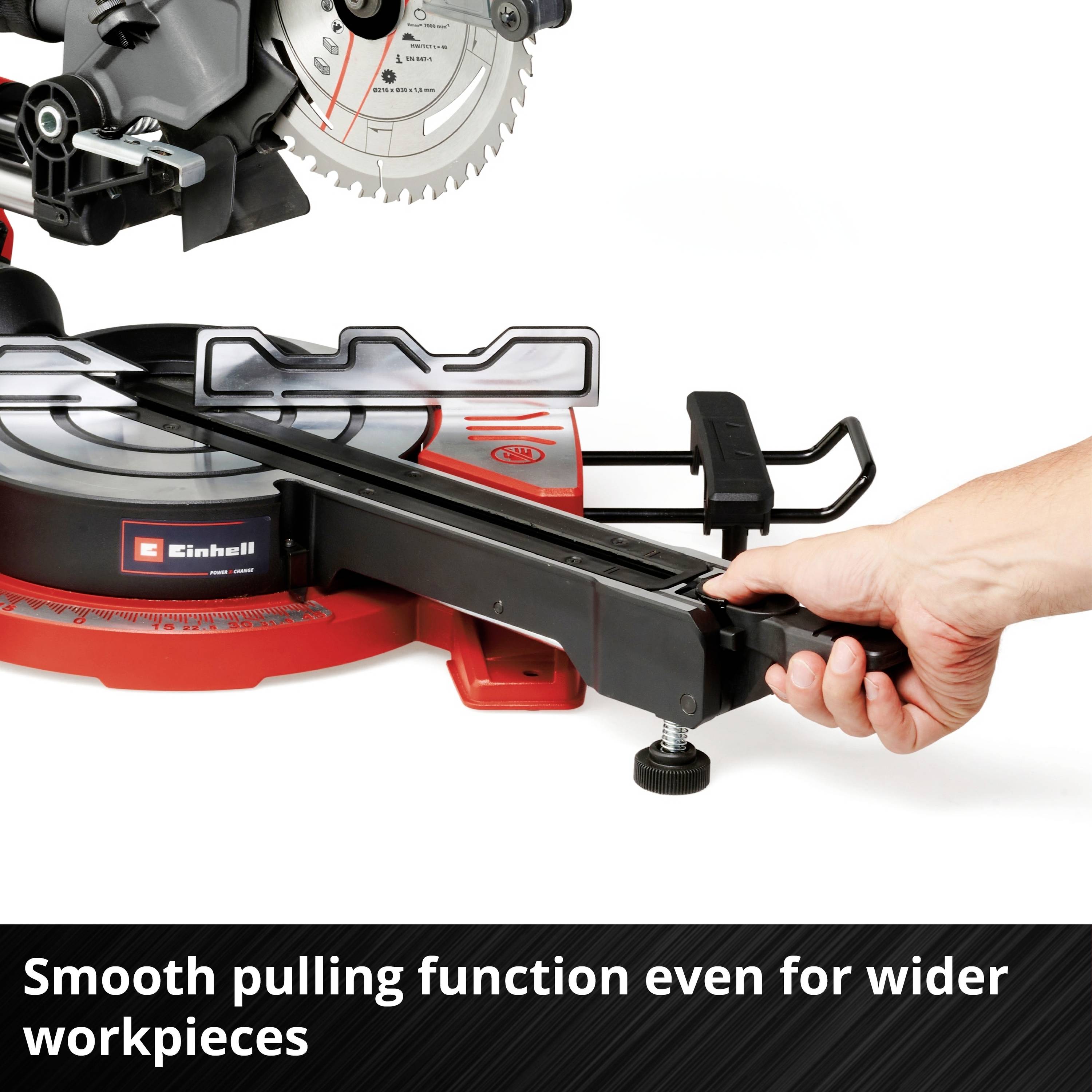 Electric mitre saw with operator hand grip, adjustable for wider workpieces. Text: 'Smooth pull function also suitable for wider workpieces'.
