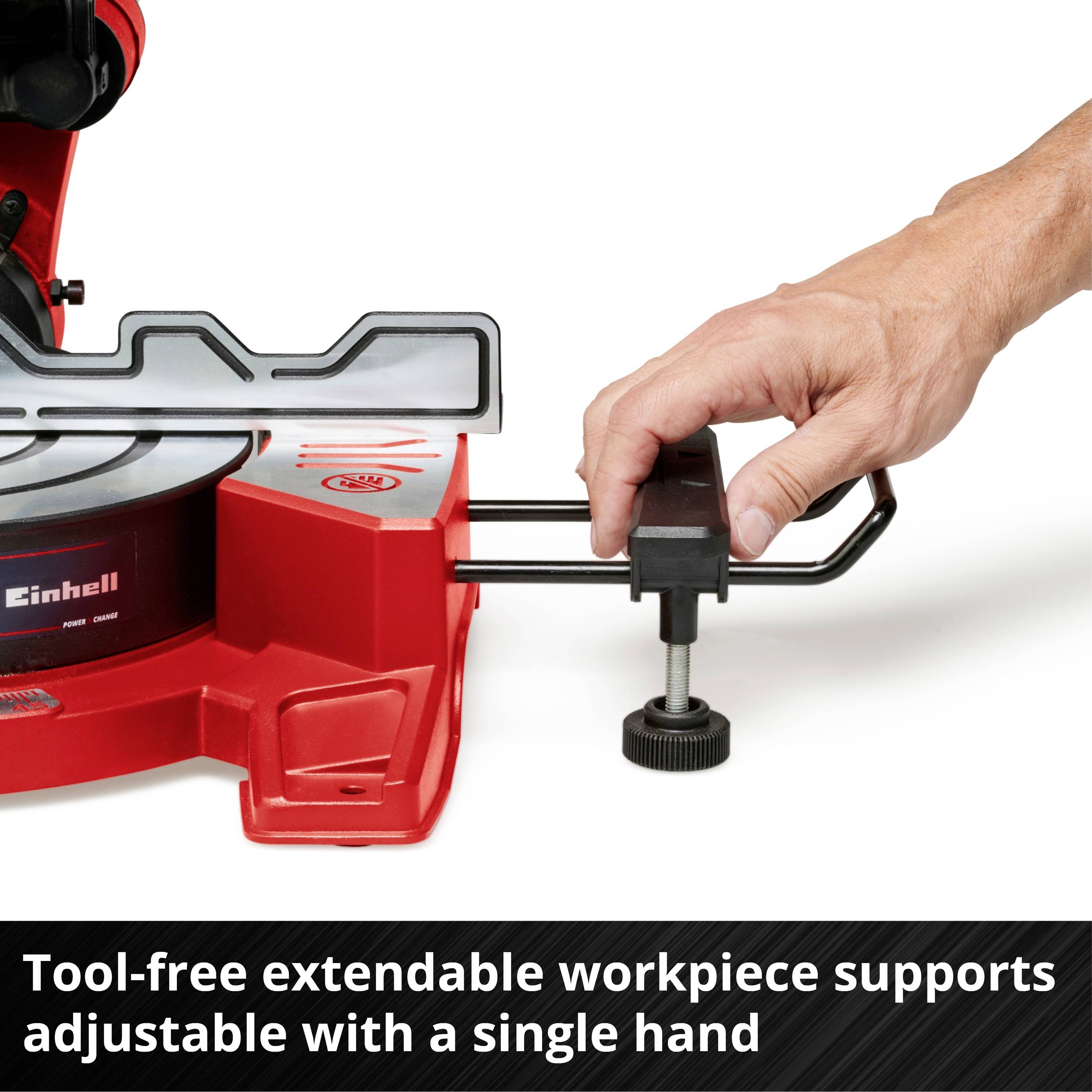 A hand operates a red mitre saw cutting a wooden board. The saw head is adjustable up to 45° to the left.