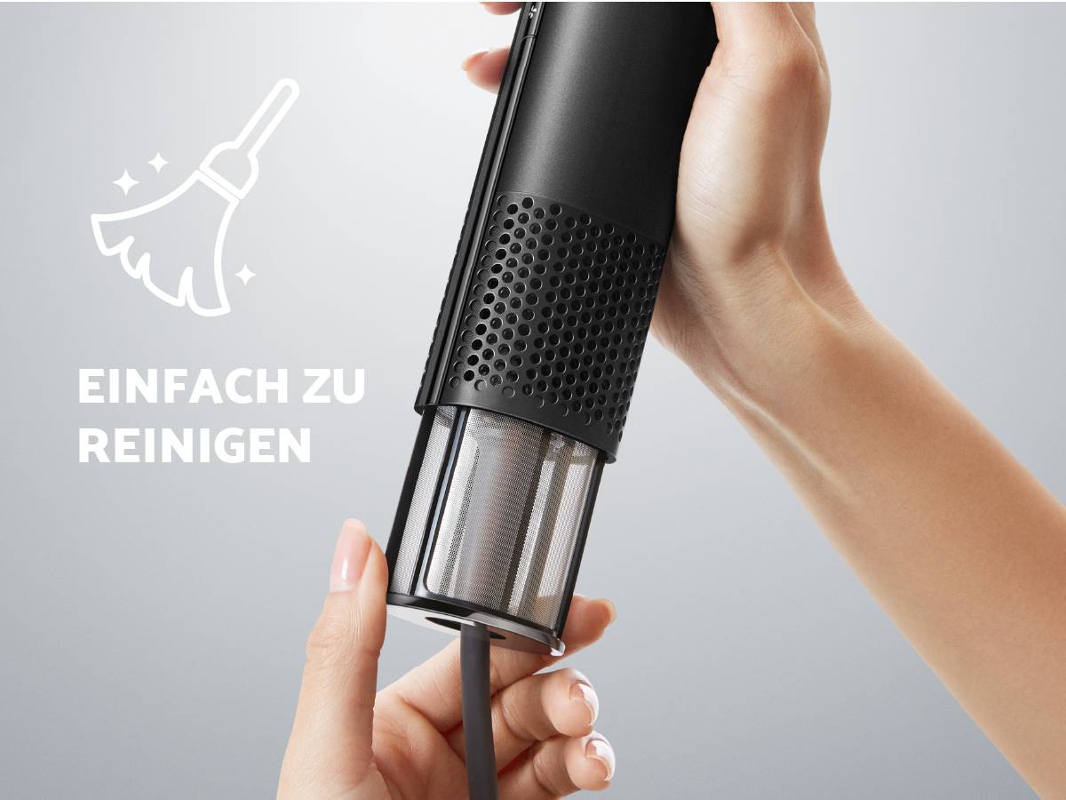 Hands holding a vacuum cleaner and emptying the dust container. Text: 'Easy to clean'.