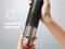 Hands holding a vacuum cleaner and emptying the dust container. Text: 'Easy to clean'.