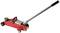 A red hydraulic jack with a long lever arm and black wheels, ready to be used for lifting vehicles in the workshop.
