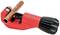 A red pipe cutter with a black handle is holding a copper pipe.