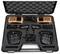 Two orange-coloured walkie-talkies with aerials in a black case, including chargers and accessories. Ideal for professional communication.