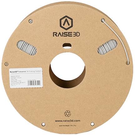 A brown spool of Raise3D 3D printer filament, with label displaying material information.