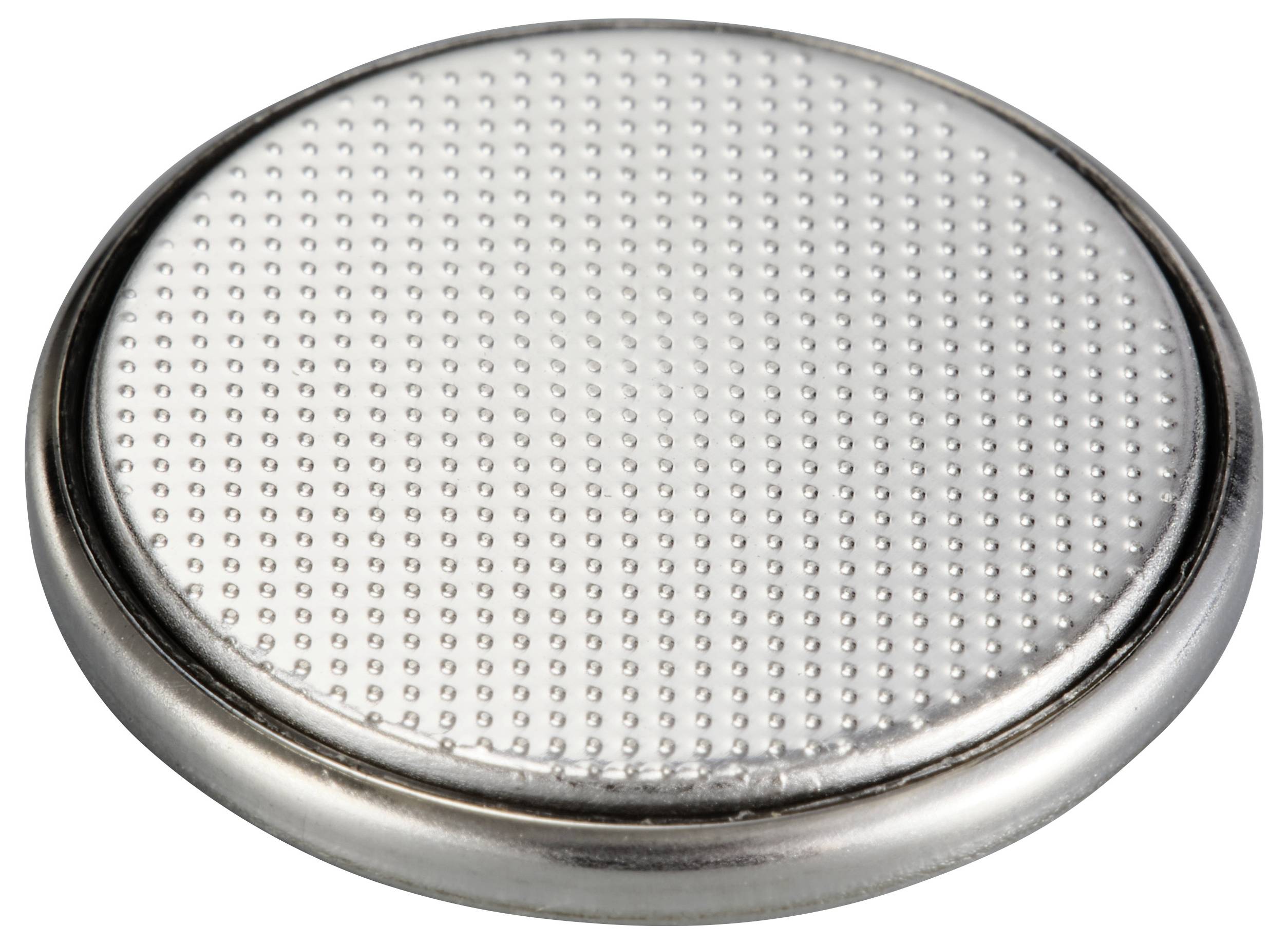 Round button cell battery with silver, dotted surface, close-up. Suitable for small electronic devices.