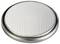 Round button cell battery with silver, dotted surface, close-up. Suitable for small electronic devices.