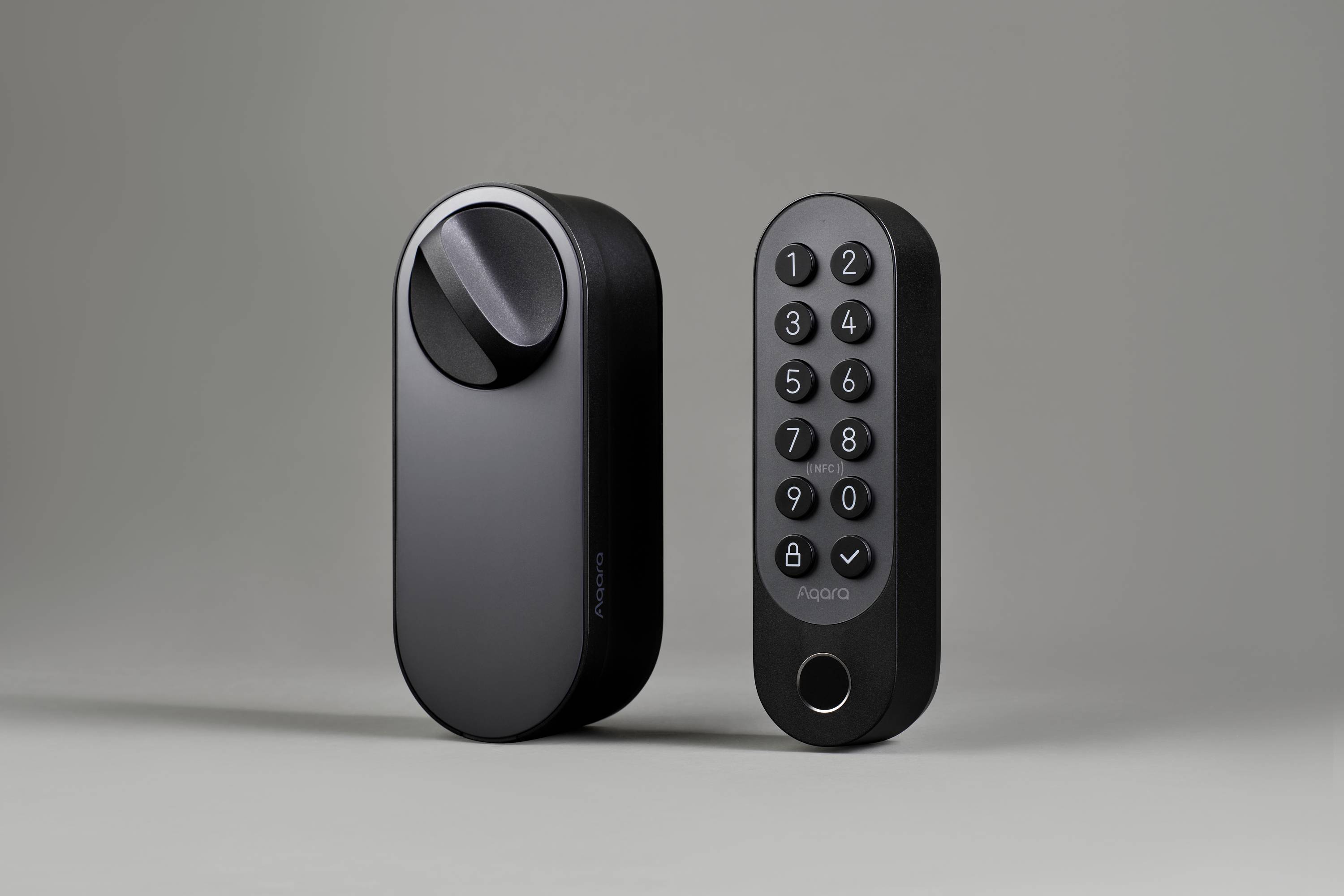 'Black smart lock with numeric keypad and rotary knob, suitable for modern security systems, against a grey background.'