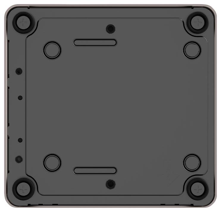 Rear view of a square black box with rounded corners and four screws at the corners.