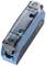 A blue electric circuit breaker with two mounting holes and a transparent plastic cover, photographed at an angle from above.