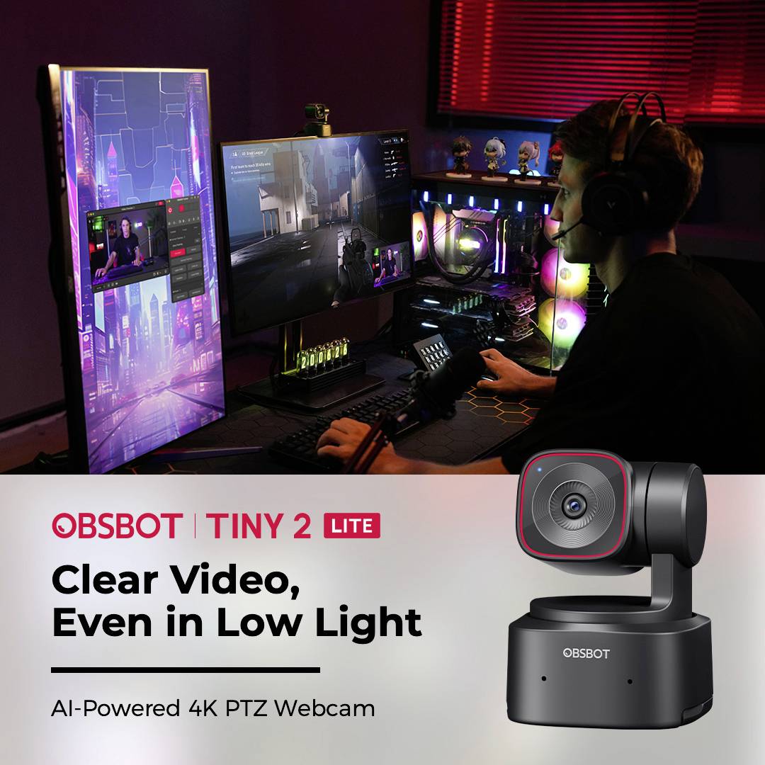 A man in a dark room is using a computer with multiple screens. Text on the image: 'OBSOT TINY 2 LITE: Clear Video, Even in Low Light'