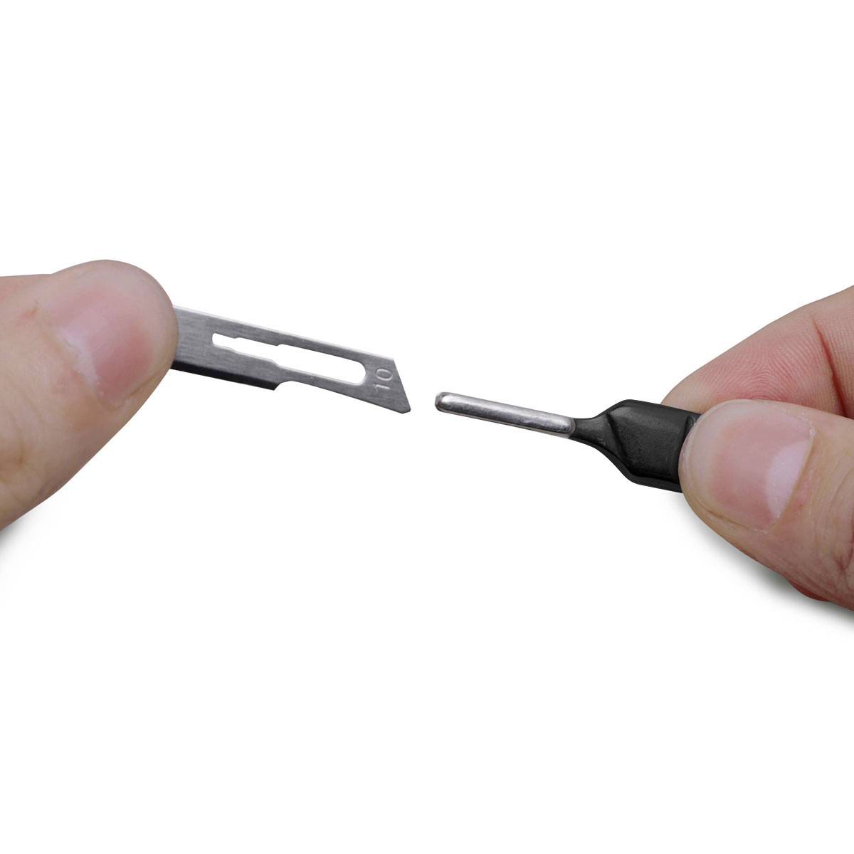 Two hands are holding a razor blade and a screwdriver bit in opposite directions, as if they are about to be fitted together.