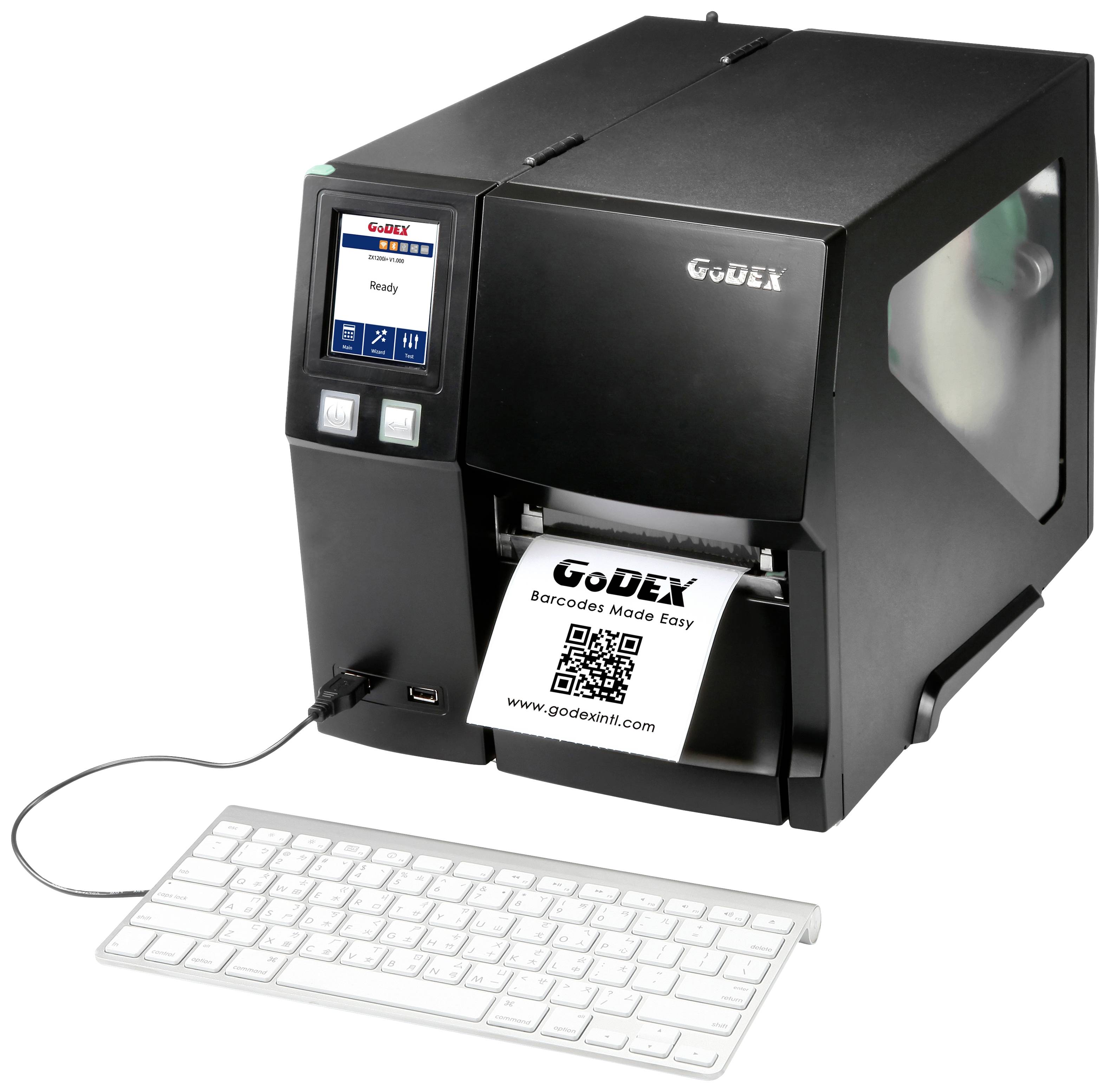 A GoDEX label printer prints a label with the text 'GoDEX Barcode MADE Easy' and a QR code, connected to a keyboard.