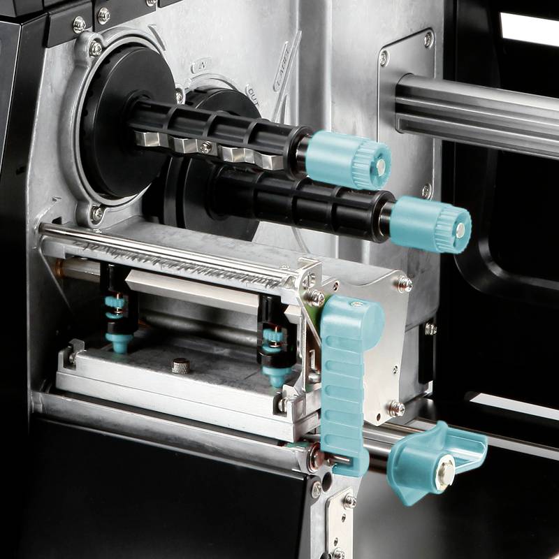 A close-up of a printer showing its internal mechanical parts with various rollers and levers in turquoise and black.
