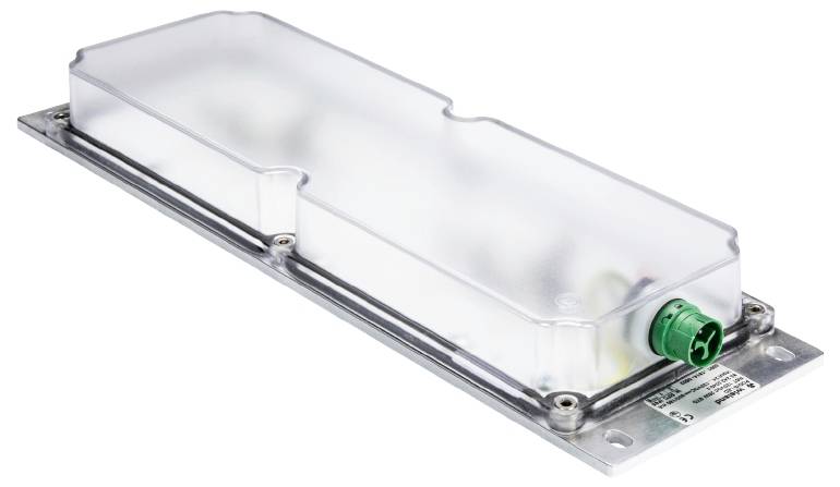 A rectangular electronic component with a green connector on one side, mounted on a metal plate.